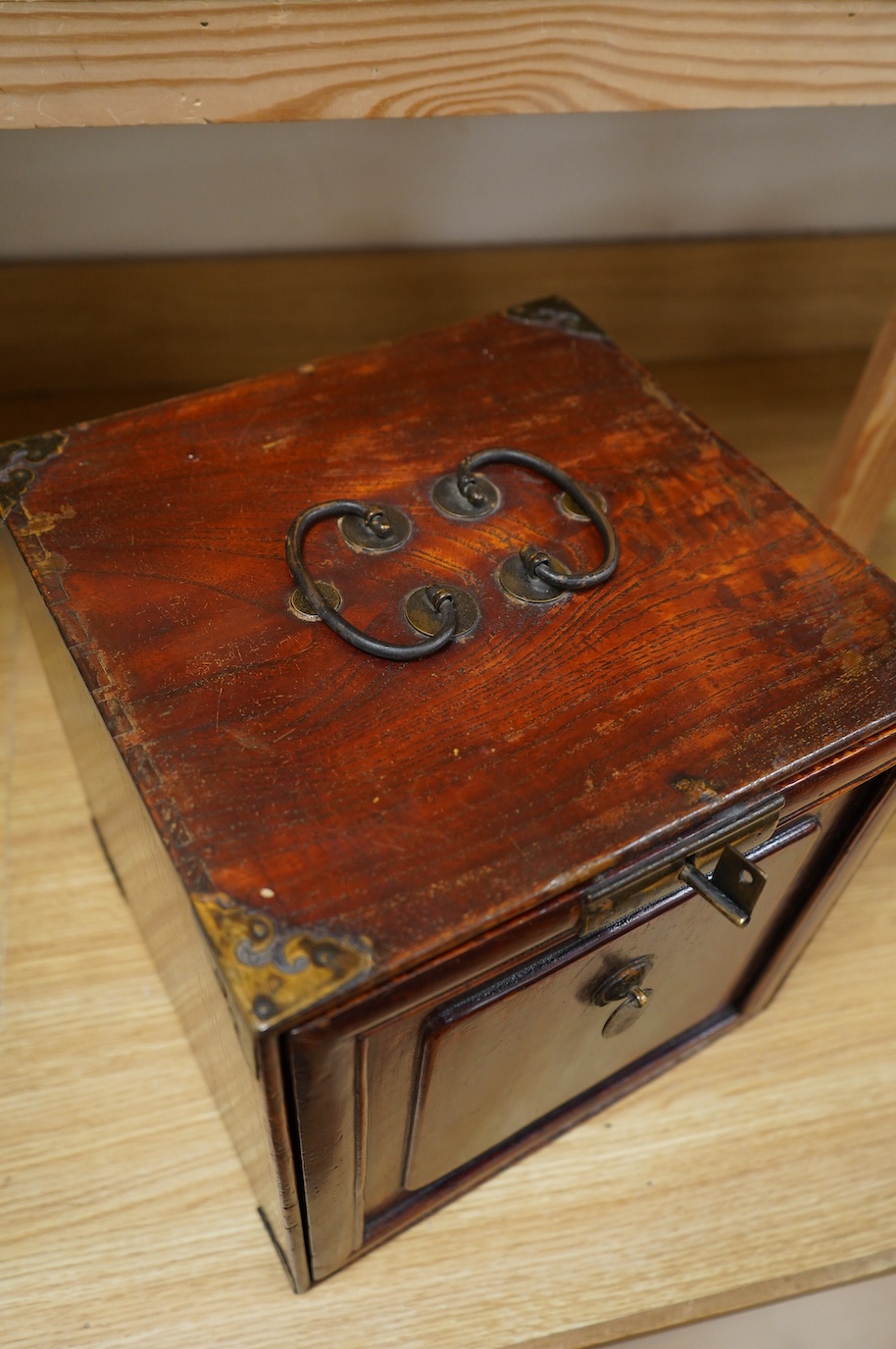 A 19th century Chinese elm scholar's seal cabinet with key, 31cm high. Condition - fair